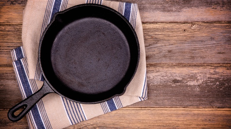 cast iron skillet on towel