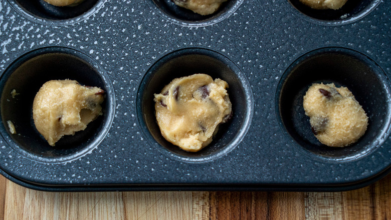 raw cookie dough in muffin tin
