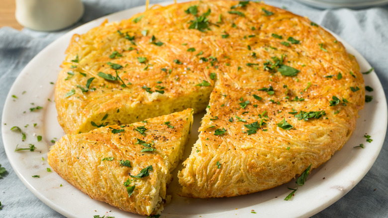 spaghetti frittata on white plate