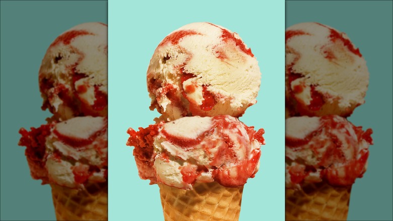 Scoops of sour cherry creamsicle in ice cream cone