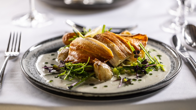 Smoked trout with a beurre blanc sauce.