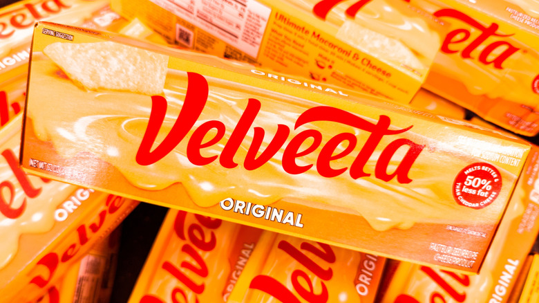Boxes of Velveeta products on a store shelf.