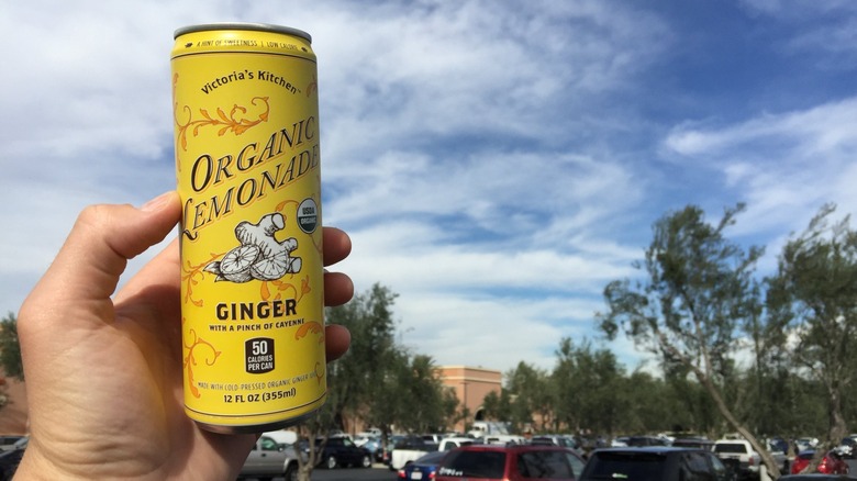 Person holding a can of Victoria's Kitchen lemonade
