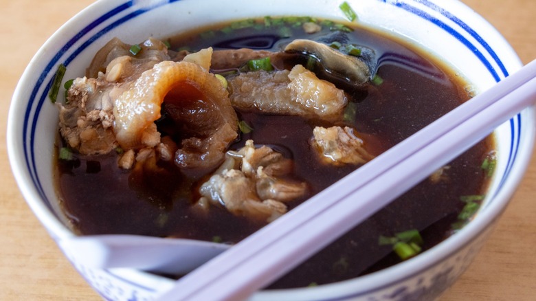 Turtle soup served with chopsticks