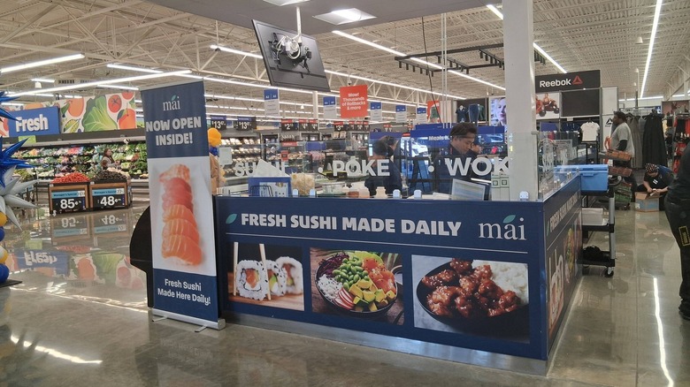 Chef work in a sushi station at a Walmart store