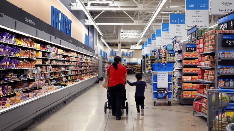Shoppers inside of a Walmart.