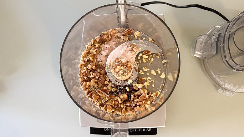 Walnuts, garlic, salt, and pepper in food processor