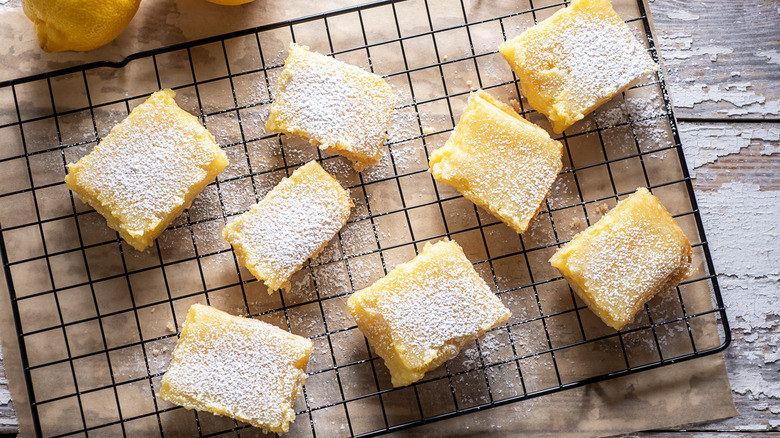Slices of lemon bars on a cooling rack