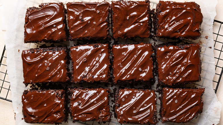 Chocolate sheet cake  with chocolate frosting sliced into pieces