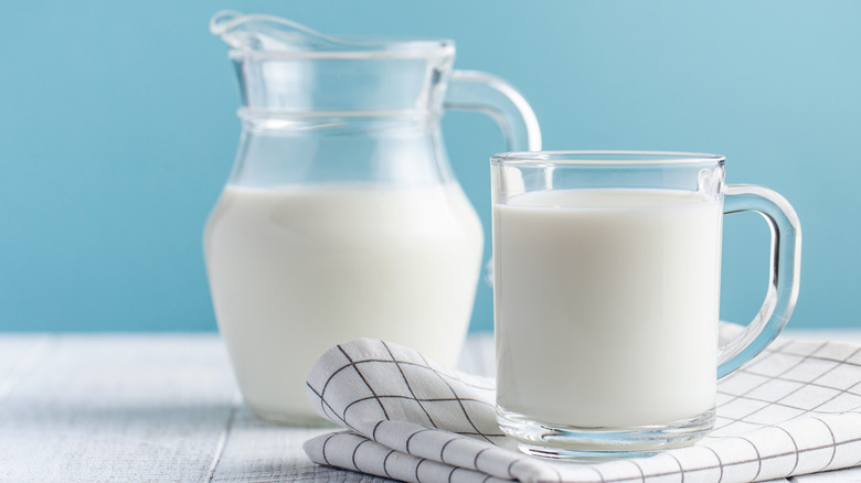 pitcher of milk with glass