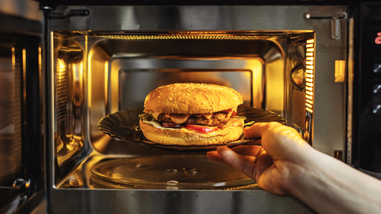 A burger going into a microwave