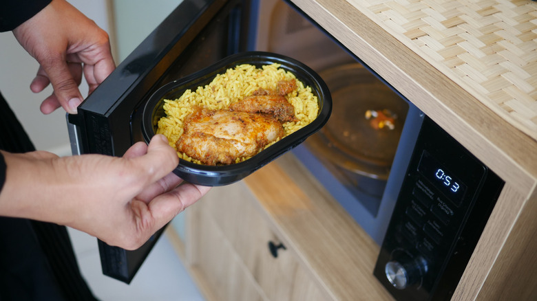 Food going into a microwave