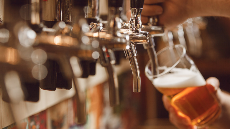 beer poured from a tap