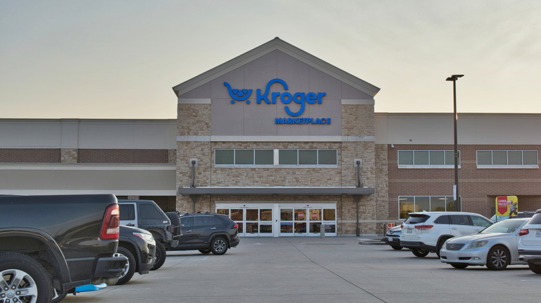 Cars parked outside a Kroger grocery store