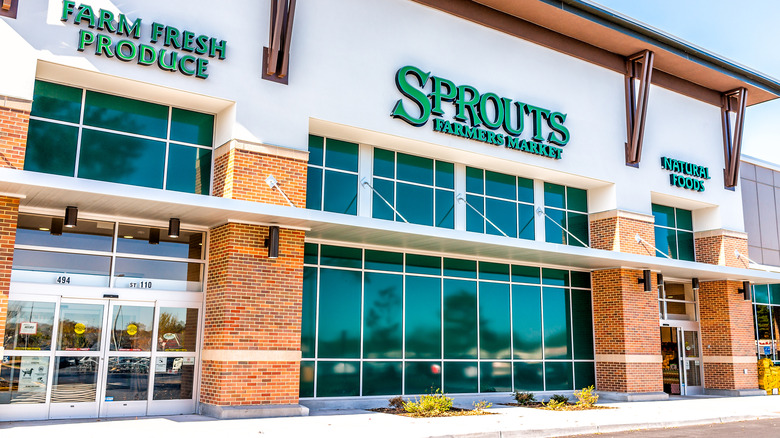 Exterior of Sprouts grocery store with windows and glass doors