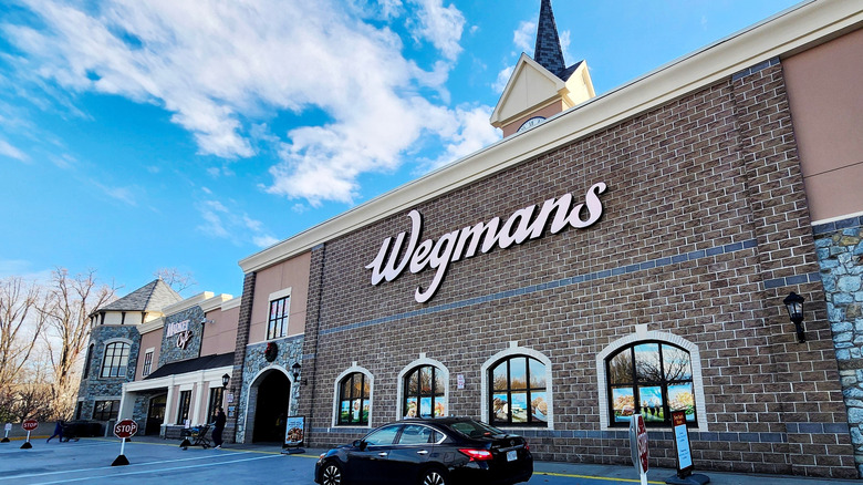 A Wegmans grocery store against a blue sky
