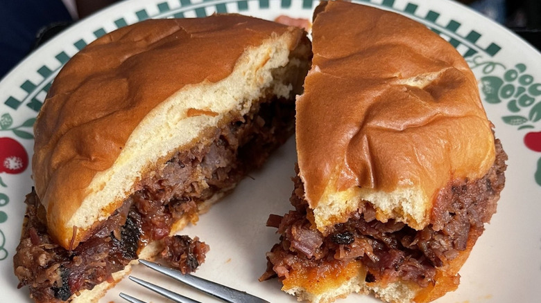A halved Buc-ee's brisket sandwich on plate