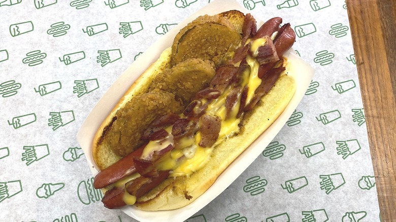 Fried pickle bacon cheese hot dog