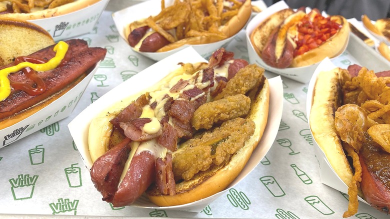 Tray of loaded Shake Shack hot dogs