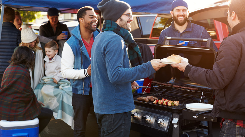 friends tailgating a football game