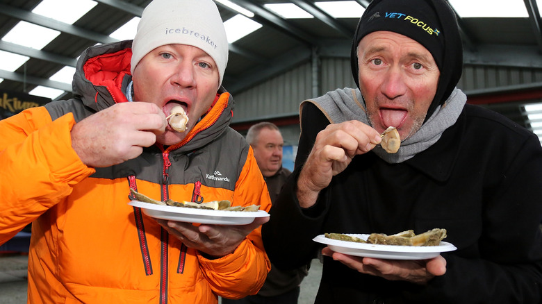 People eating fresh Bluff oysters