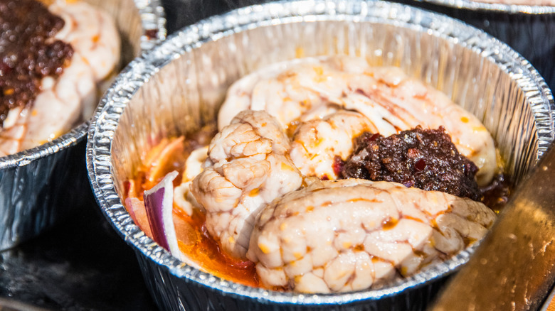 Roasted pig brain in foil pan