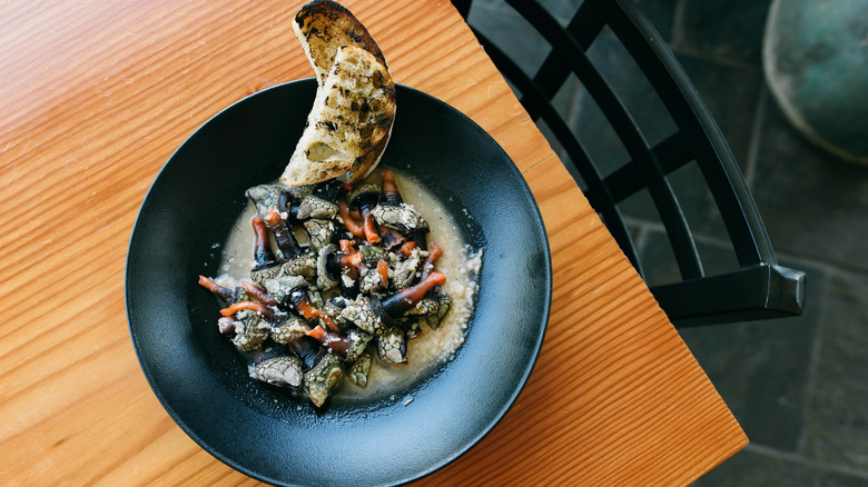 gooseneck barnacles in bowl with broth