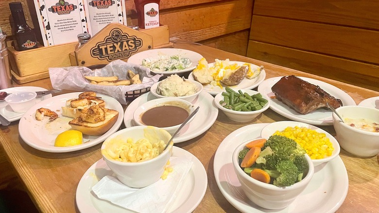 Collection of Texas Roadhouse side dishes on table in restuarant