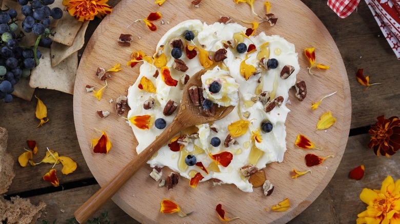 butter spread with flowers, fruit, and nuts