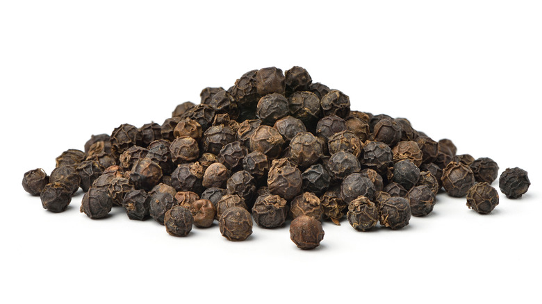 pile of black peppercorns