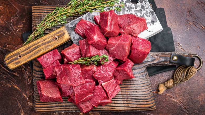 Cubed wild boar meat on a cutting board