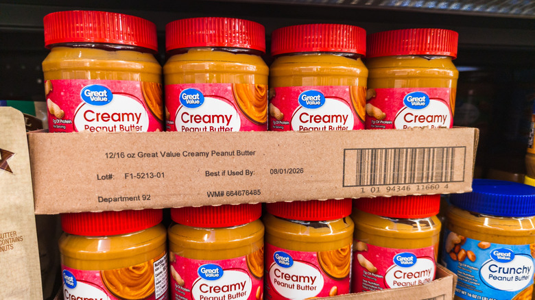 A shelf full of the Great Value peanut butter.