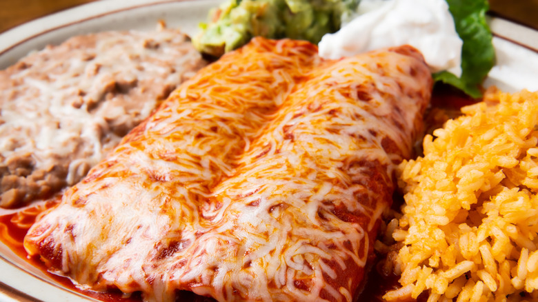 Enchiladas smothered in cheese.