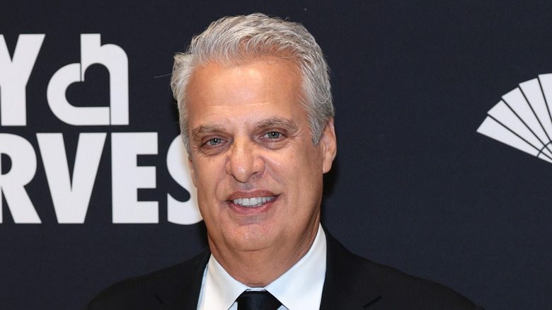 Chef Eric Ripert smiling on red carpet