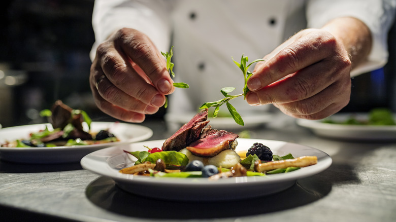 Chef making steak dish