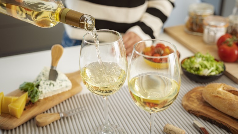 Two glasses of white wine and appetizers