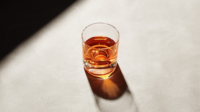 Whiskey served neat with sunlight through glass