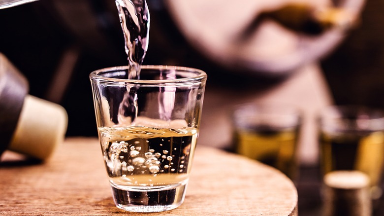 Close-up of shot being poured