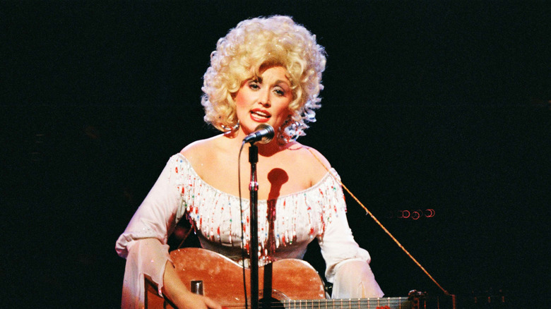Dolly Parton performing at the Dominion Theater