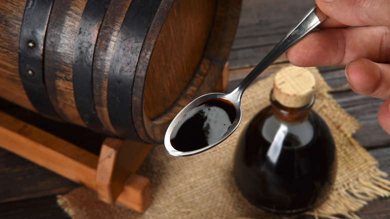 spoonful of balsamic vinegar with barrel