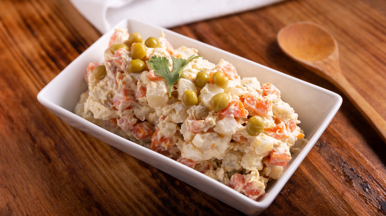 Russian salad in a rectangular dish