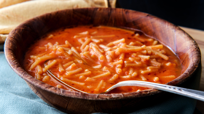 sopa de fideo served in wooden bowl