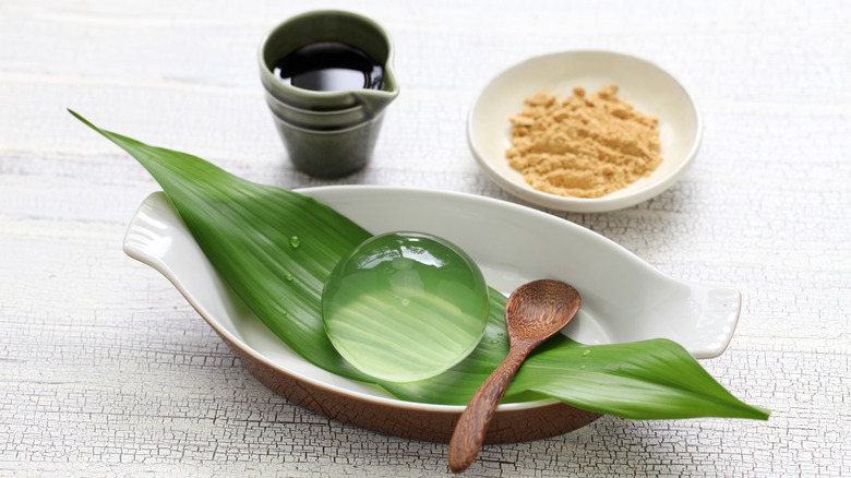 Japanese raindrop cake with black sugar syrup and roasted soy flour