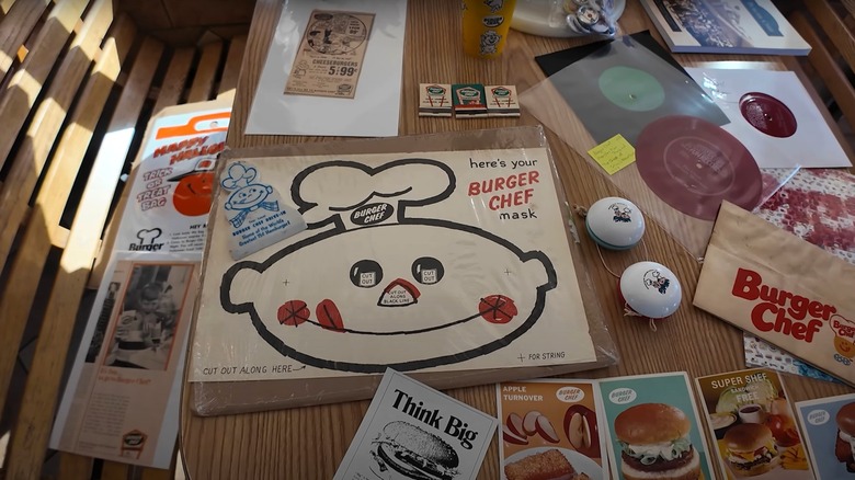 The inside of the last Burger Chef, a table is covered in Burger Chef memorabilia