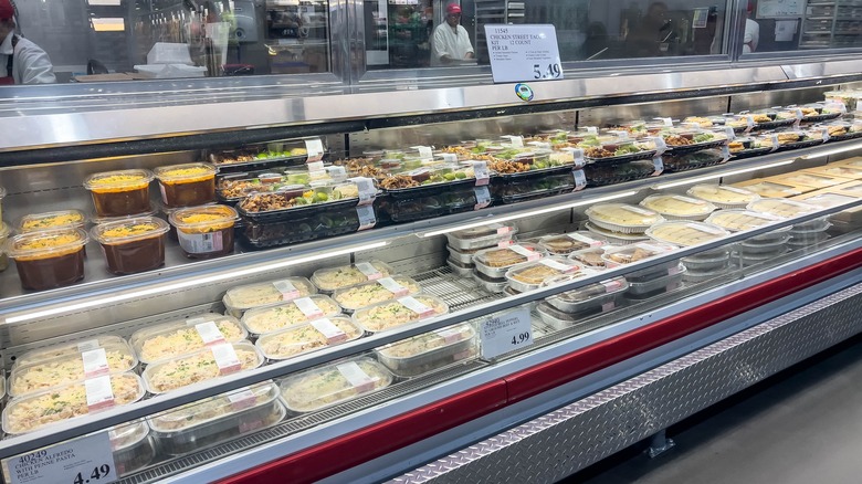 Fresh, prepared meals sits in a refrigerated case inside a Costco