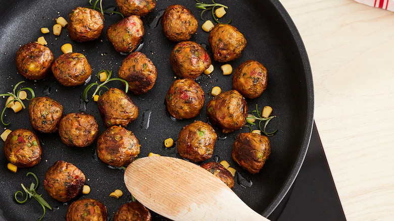 IKEA vegetarian meatballs in pan with corn and herbs