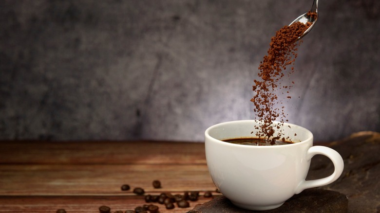 Instant coffee being poured into a cup