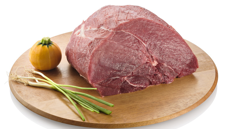 plate with raw beef knuckle