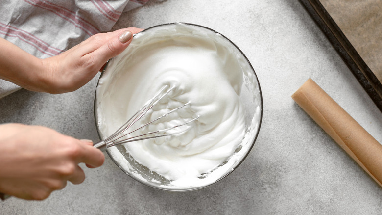 woman whisking egg whites