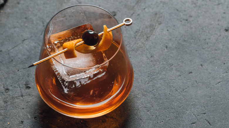 bourbon with a fruit flag as garnish